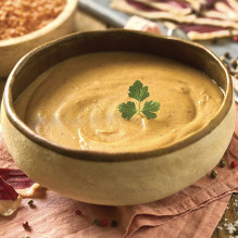 Velouté aux lentilles corail et magret fumé
